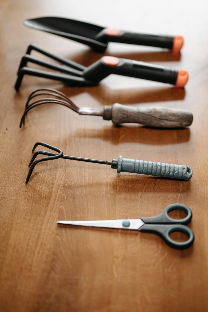 Gardening tools are on a brown color surface